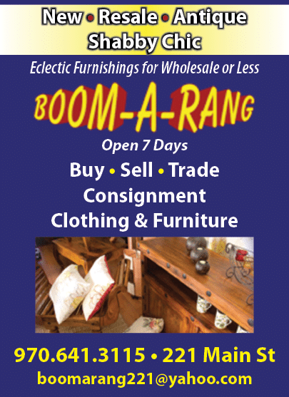 A blue advertisement for Boom-A-Rang, featuring a wooden table with pillows and a chair. AI generated content